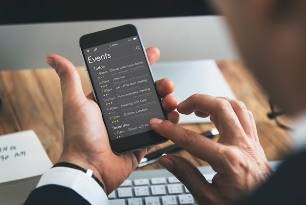 Man checking appointment on personal organizer schedule