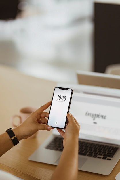 Free photo a man checking date and time on a phone