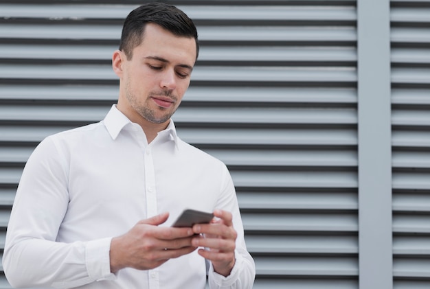 Man checking phone medium shot