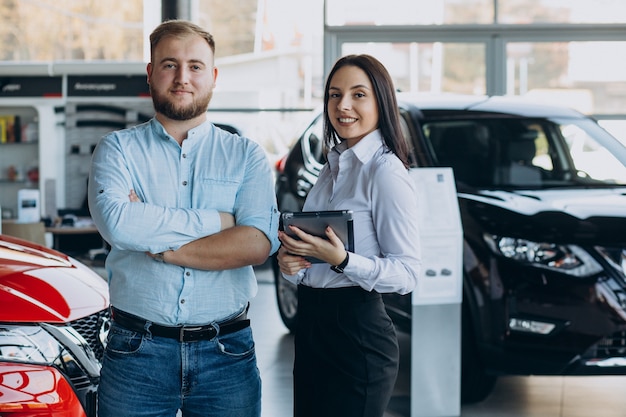 Man choosing a car and talking with salesperson