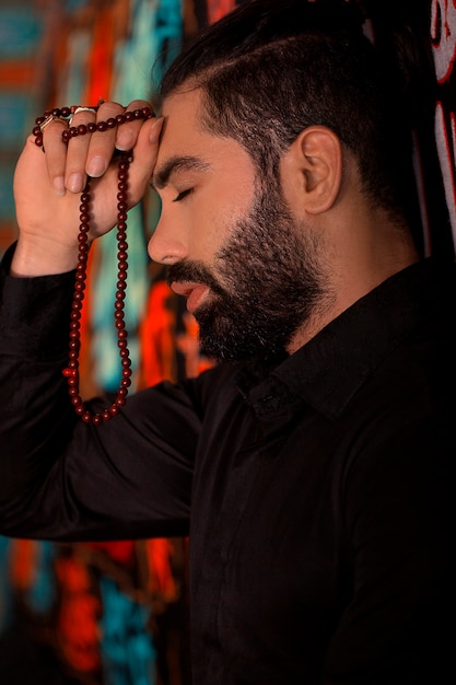 Man in classic black shirt in a restaurant