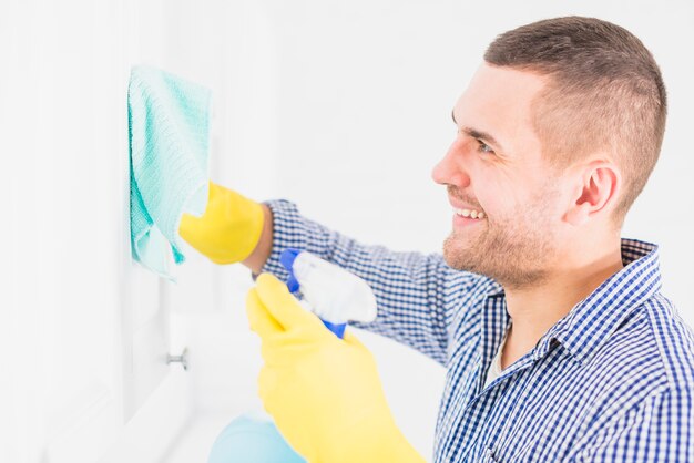 Man cleaning his home