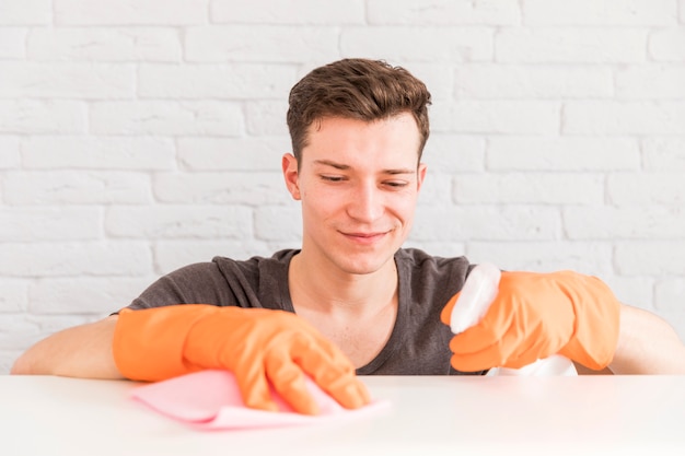 Free Photo man cleaning his home