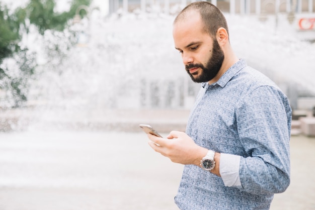 Man concentrated on phone