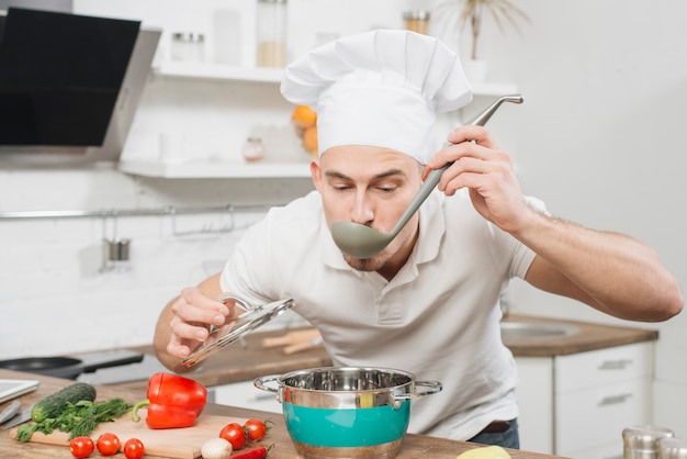 Free Photo man cooking at home