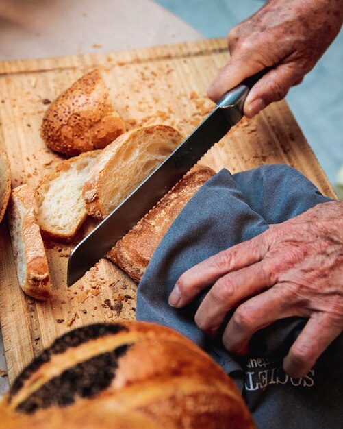 Man cuts bread loaf