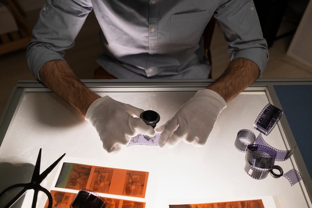 Man developing photographs high angle