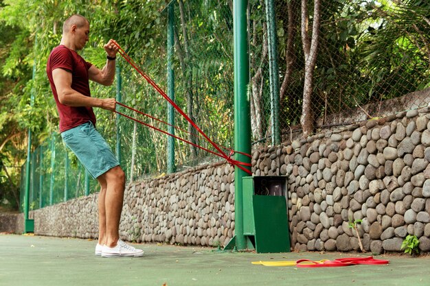 A man doing with rubber bands. bali