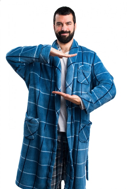 Free photo man in dressing gown holding something