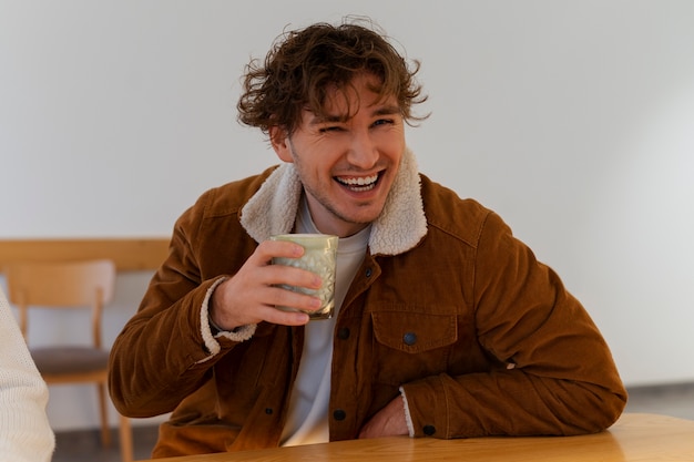 Free photo man drinking matcha tea