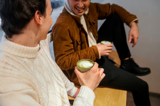 Free photo man drinking matcha tea