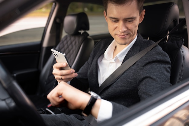 Man driving his elegant car for taxi services