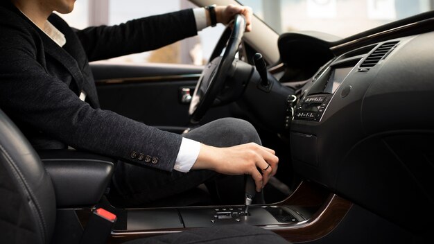 Man driving his elegant car for taxi services