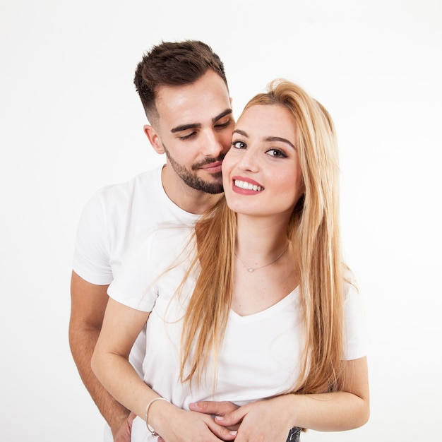 Man embracing cheerful woman