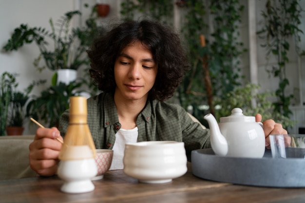 Man enjoying a cup of matcha tea