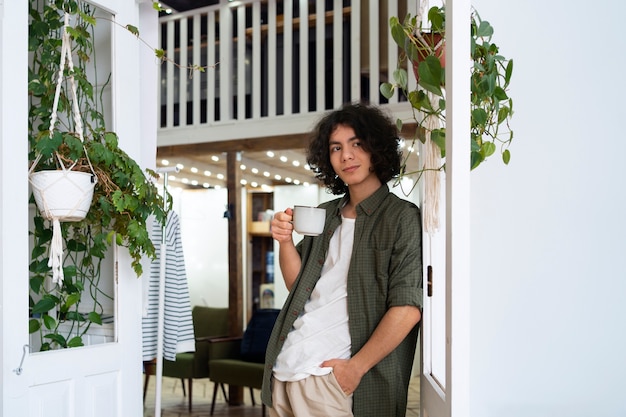 Free Photo man enjoying a cup of matcha tea