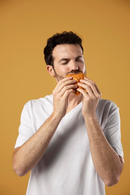 Man enjoying eating a burger