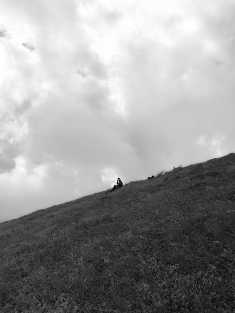 Free photo man enjoying his time alone in the mountain