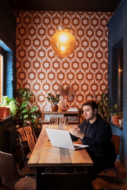 Free photo man enjoying his virtual date