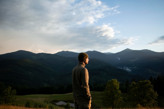 Free photo man enjoying rural surroundings