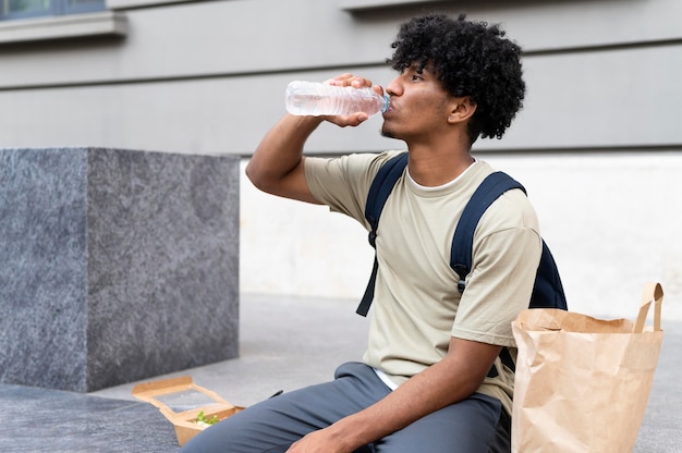 Man enjoying some takeaway food outdoors