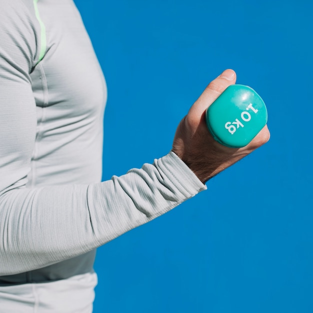 Man exercising with dumbbell