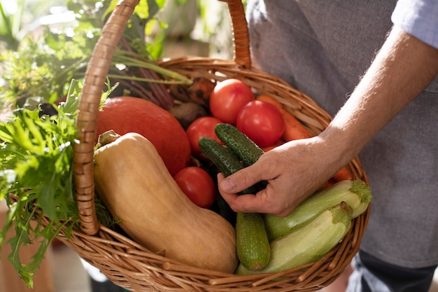 Man farming vegetables in his indoor garden