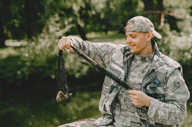 Man fishing and holds the angling rod