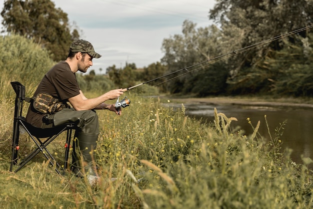 Free photo man fishing at the river