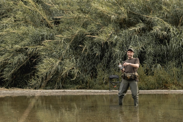 Free photo man fishing at the river