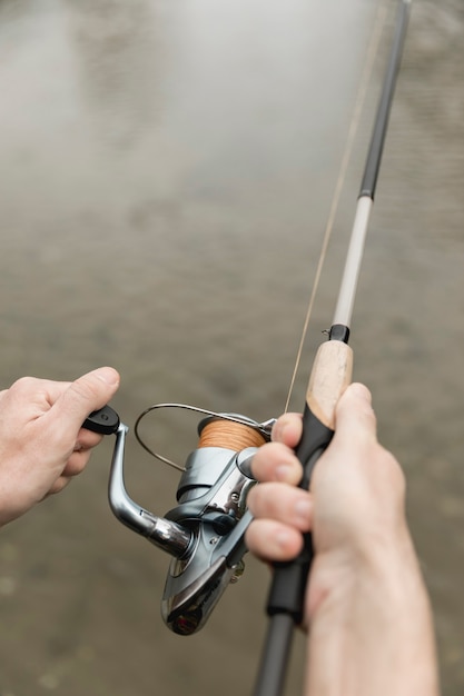 Free photo man fishing at the river