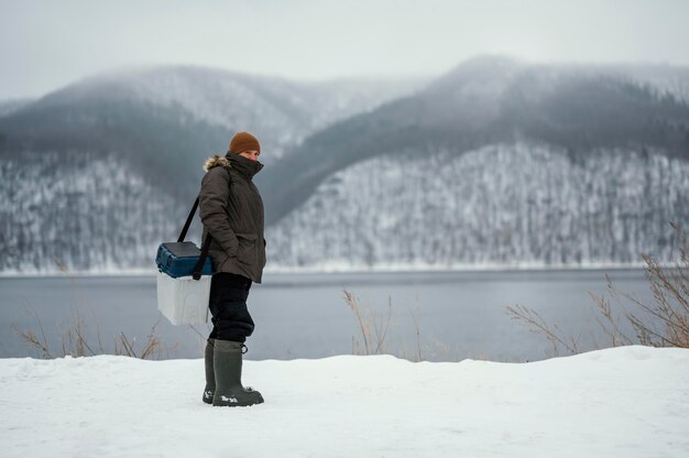 Man fishing with special equipment outside