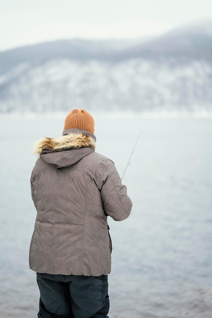 Free photo man fishing with special equipment