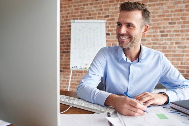 Man focused while working on computer