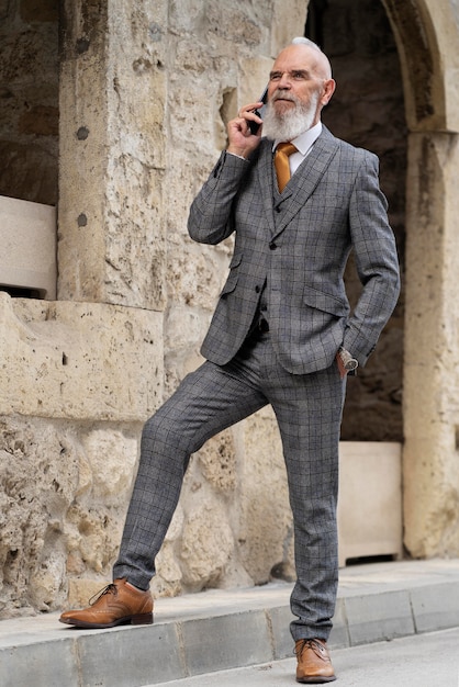 Man in formal clothes talking on the phone