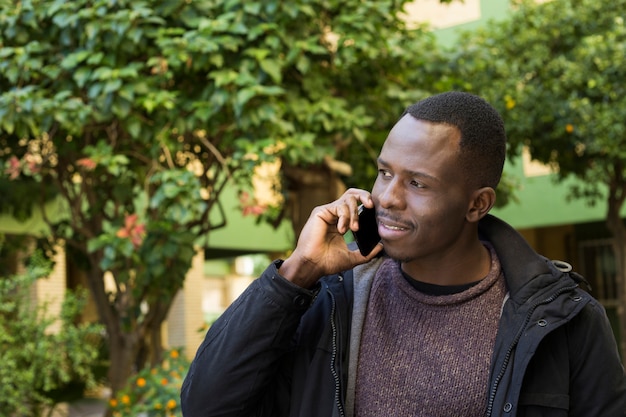 Man in garden doing phone call