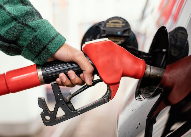 Man at gas station with the car close up