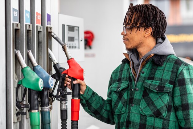 Man at gas station with the car