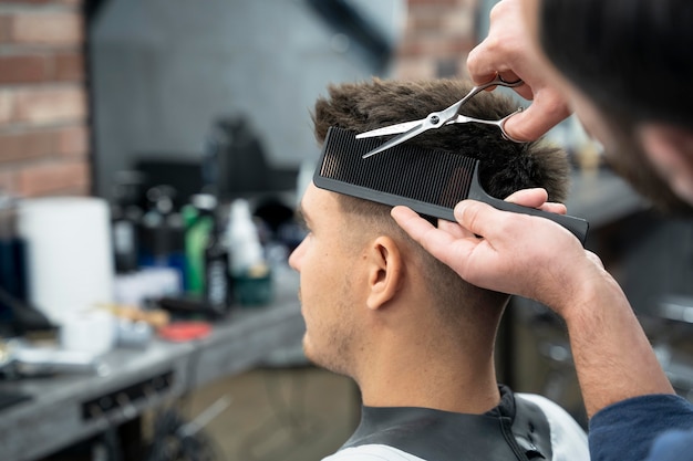 Man getting a haircut close up