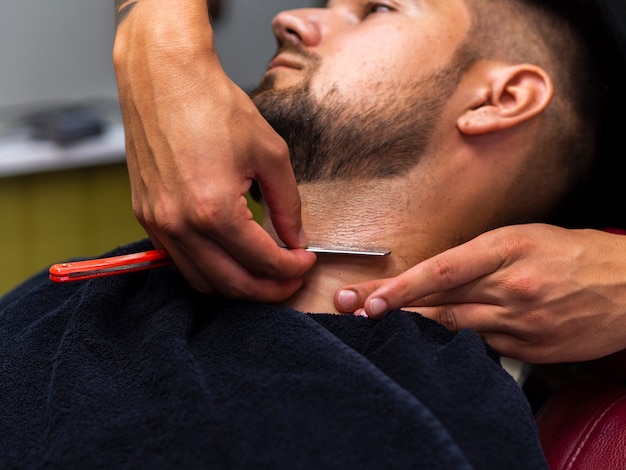 Man getting his beard cut