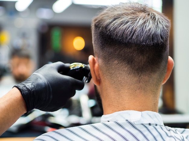 Man getting a new haircut from behind