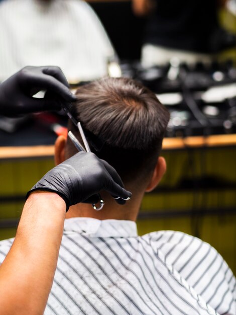 Man getting a new haircut from behind