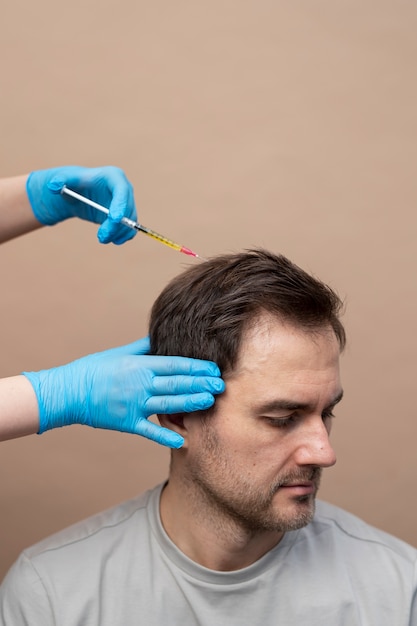 Man getting prp injection for alopecia