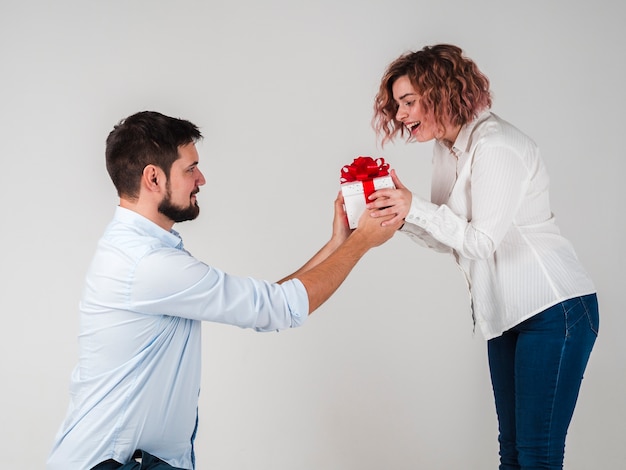 Man giving gift to woman for valentines