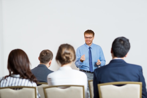 Man giving a lecture to an audience