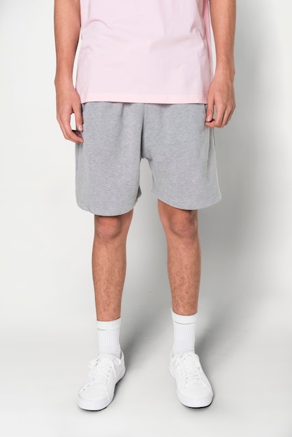 Free photo man in gray shorts for summer apparel shoot