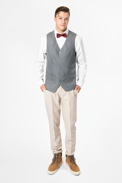 Free photo man in gray vest suit and bow tie men's formal attire full body