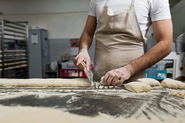 Man hardworking in a bread bakery