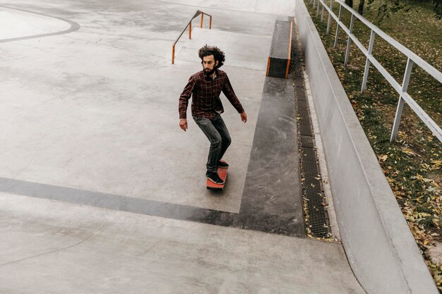 Man having fun with skateboard outside