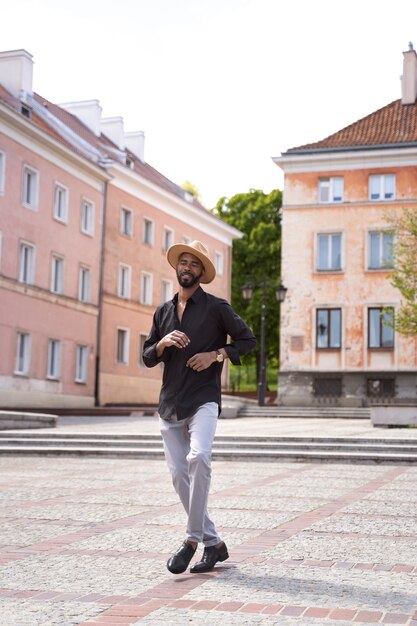 Man having a latin dance performance in the city